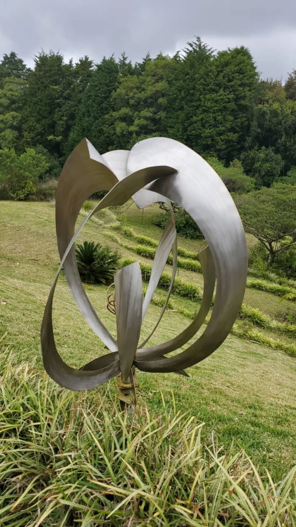 Brushed steel sculpture on the lawn