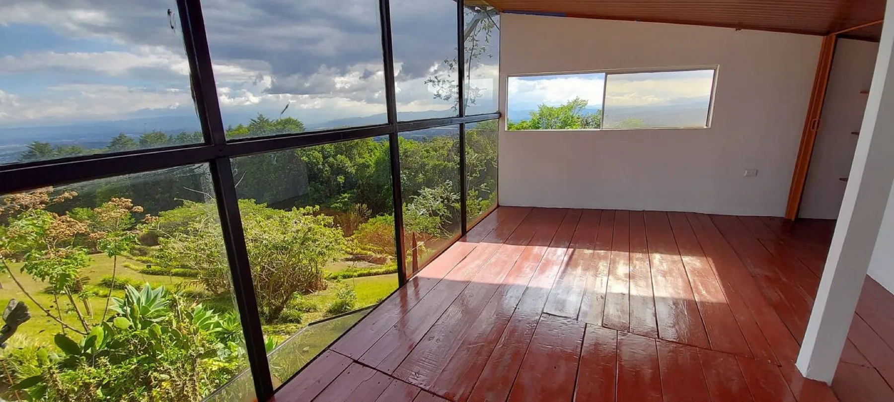 Upper level with panoramic glass and polished plank floor